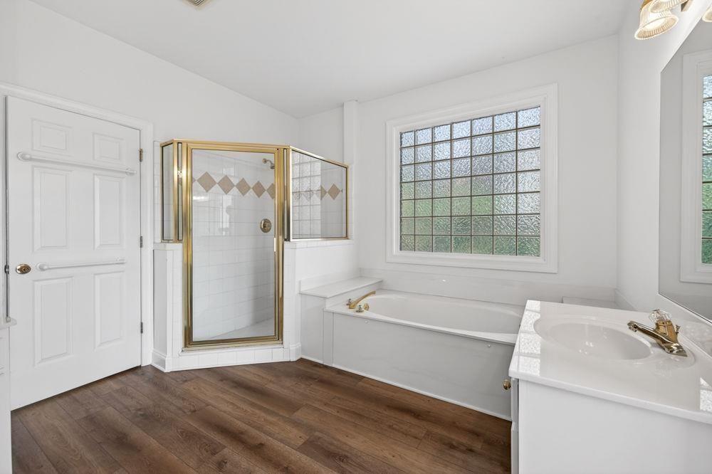 7512 Fieldstone Way Monroe, GA 30656 - Photo 28 of 49 a bathroom with a tub sink and a mirror