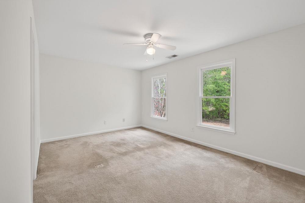 7512 Fieldstone Way Monroe, GA 30656 - Photo 33 of 49 an empty room with a window and a fan