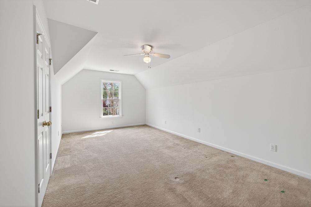 7512 Fieldstone Way Monroe, GA 30656 - Photo 39 of 49 wooden floor in an empty room with a window