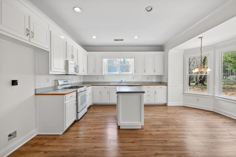7512 Fieldstone Way Monroe, GA 30656 - Photo 4 of 49 a kitchen with a white wooden cabinets and white appliances