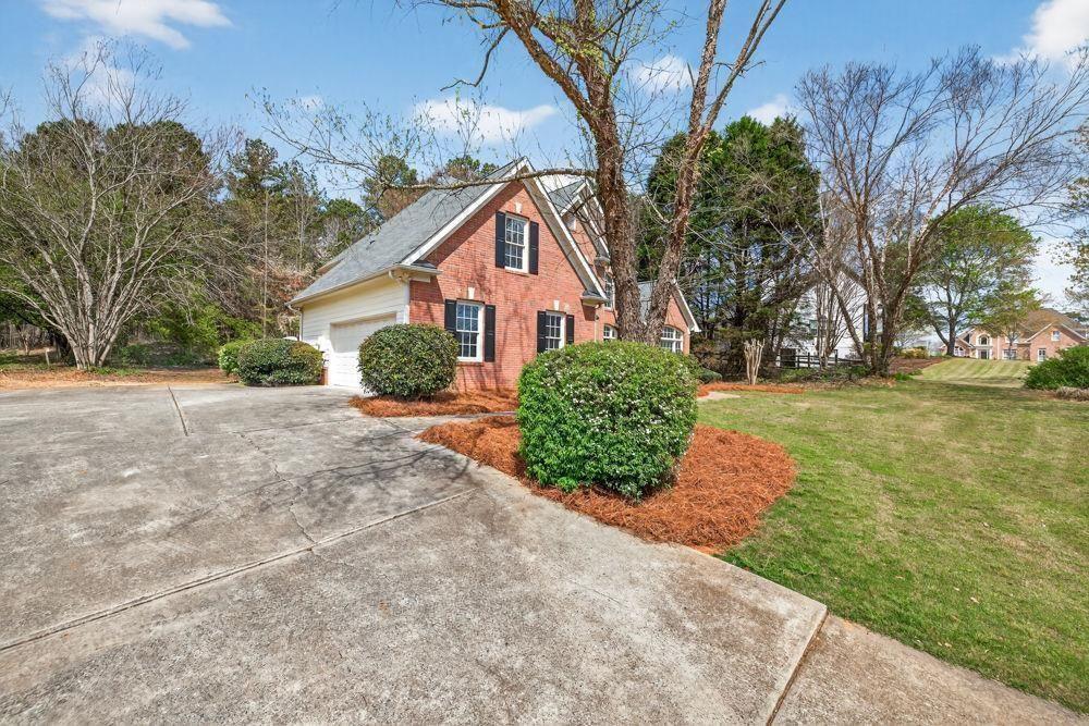 7512 Fieldstone Way Monroe, GA 30656 - Photo 10 of 49 a front view of a house with a yard