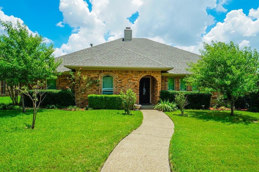 1200 Serenade Circle Plano, TX 75075 - Photo 1 of 1 a front view of a house with a yard