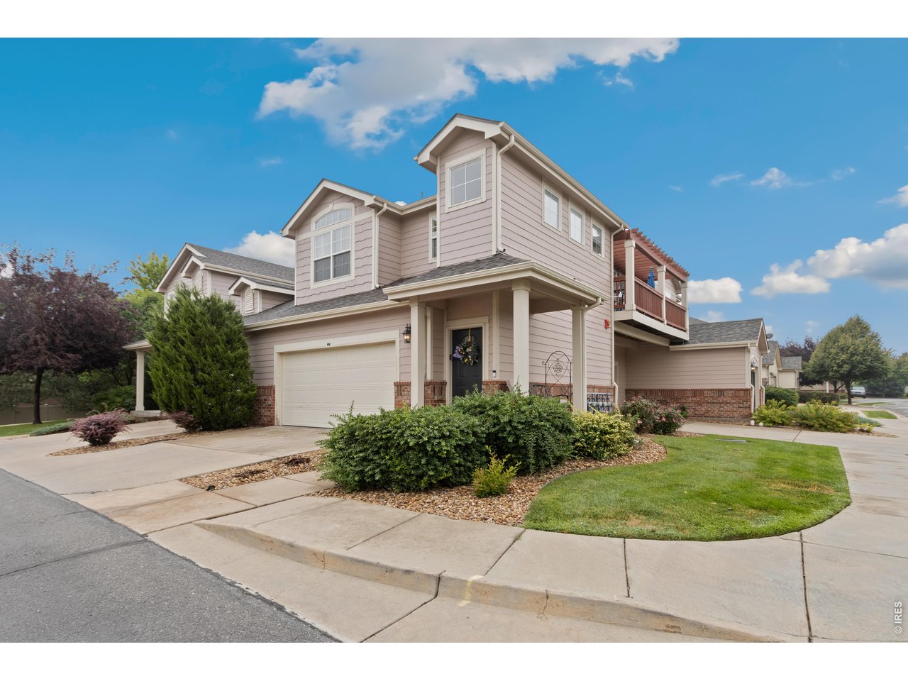 Beautiful end unit condo with attached 2 car garage