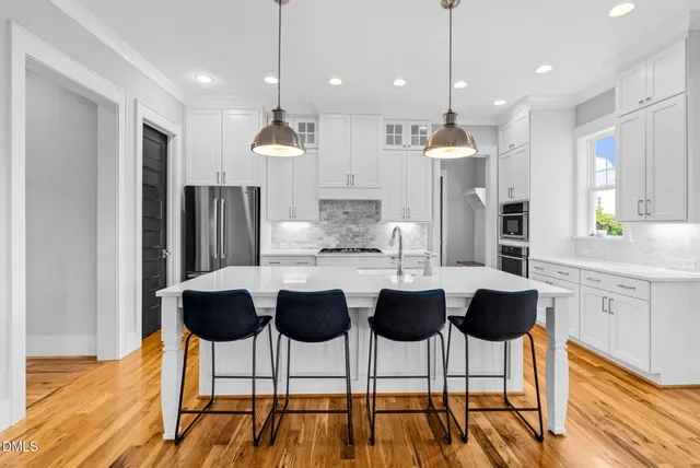 a spacious bedroom with a bed and a couch