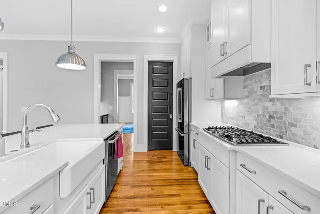 a spacious bedroom with a bed and ceiling fan