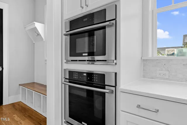 a living room with furniture and a bed