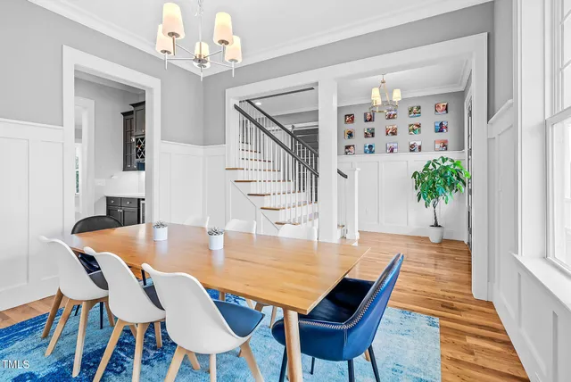 a living room with furniture wooden floor and window