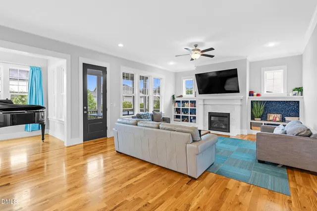 a view of a hallway with wooden floor and entryway