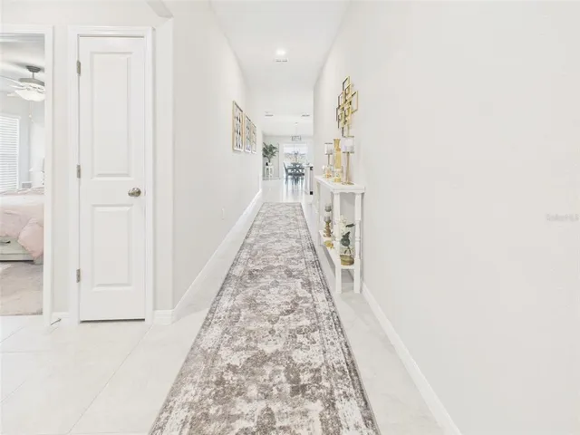 a view of a hallway with a white walls