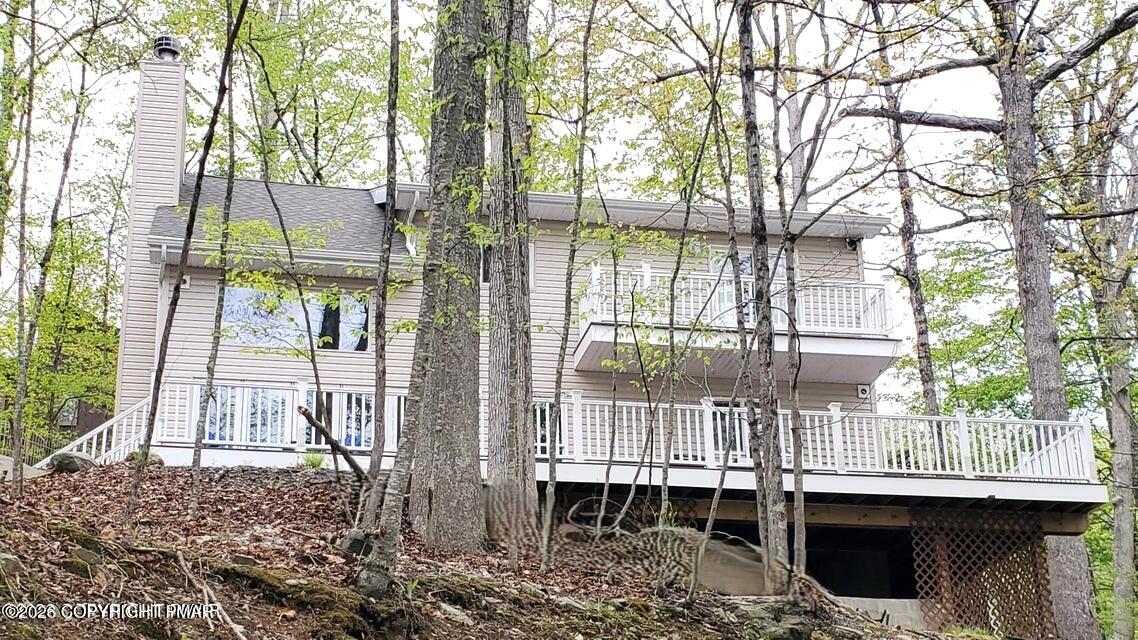 5873 Decker Road Bushkill, PA 18324 - Photo 36 of 57 a view of a house with a porch and a trees