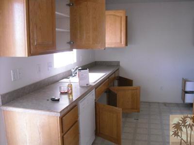 61869 Morningside Road Joshua Tree, CA 92252 - Photo 3 of 5 a kitchen with a sink cabinets and a window