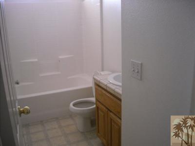 61869 Morningside Road Joshua Tree, CA 92252 - Photo 5 of 5 a bathroom with a granite countertop bathtub shower sink vanity and toilet
