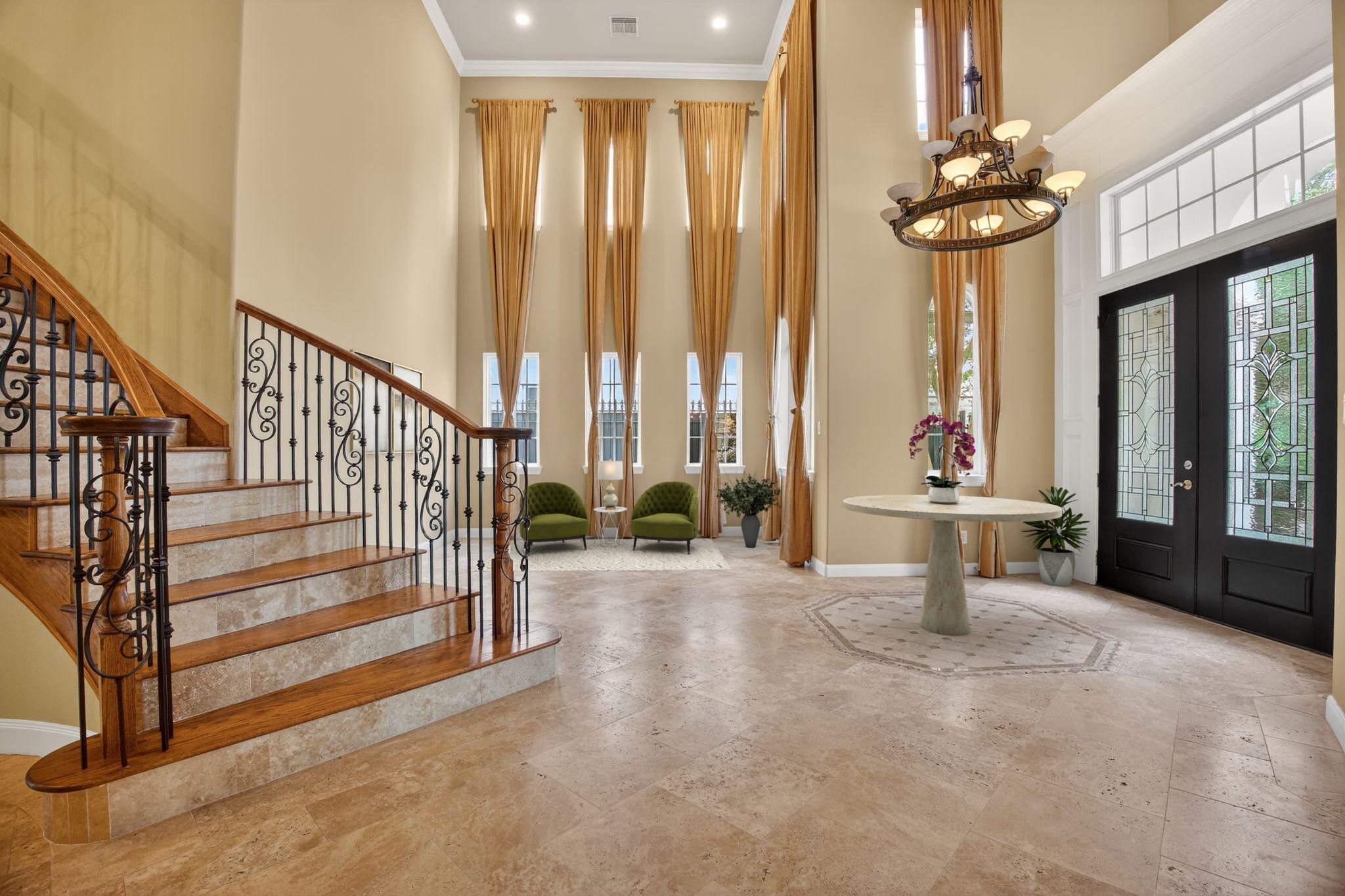 11511 Gallant Ridge Lane Houston, TX 77082 - Photo 5 of 49 a view of a room with lots of windows and flower plants