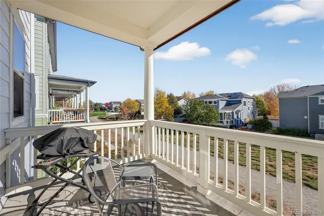 a view of balcony with furniture