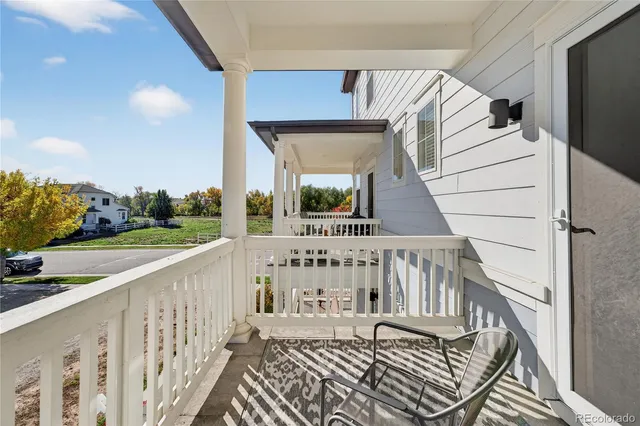 a view of balcony with wooden floor