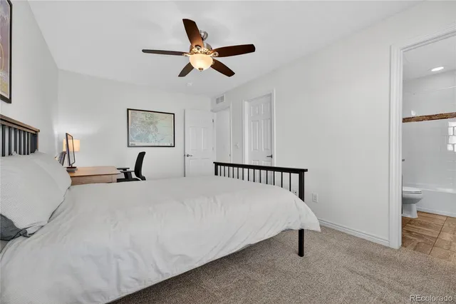 a bed room with a bed and a chandelier