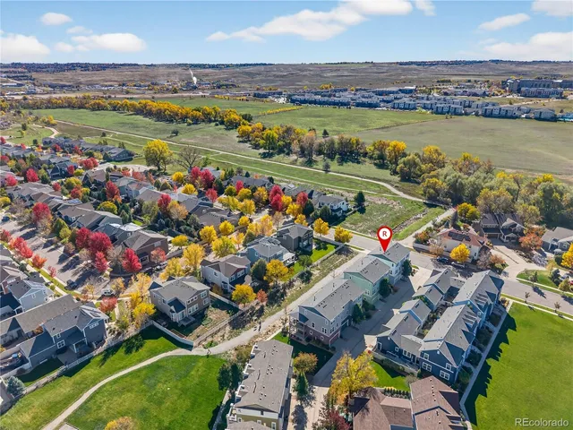 an aerial view of residential houses with outdoor space