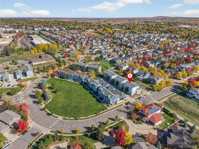 a view of a swimming pool with a table and chairs