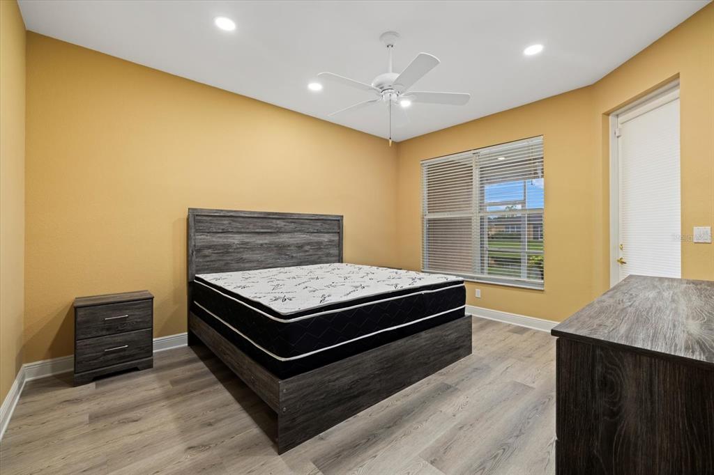 4331 Turnberry Circle North Port, FL 34288 - Photo 13 of 25 a living room with a bed furniture and a window