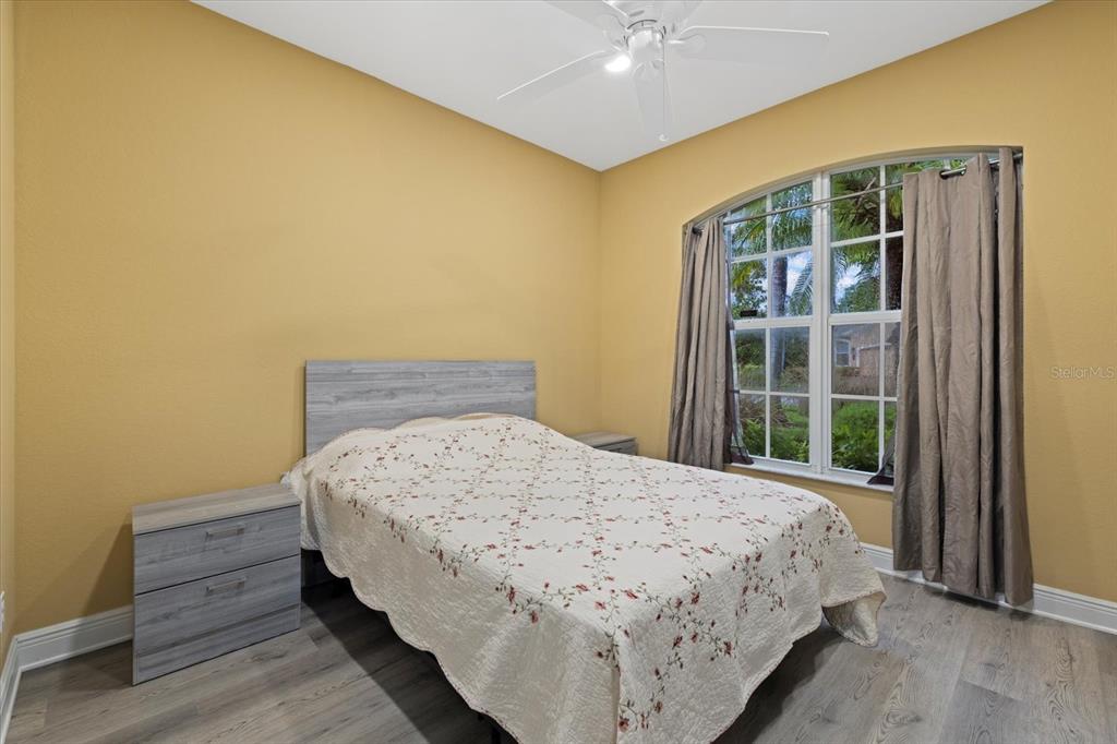 4331 Turnberry Circle North Port, FL 34288 - Photo 17 of 25 a bedroom with a bed and a window