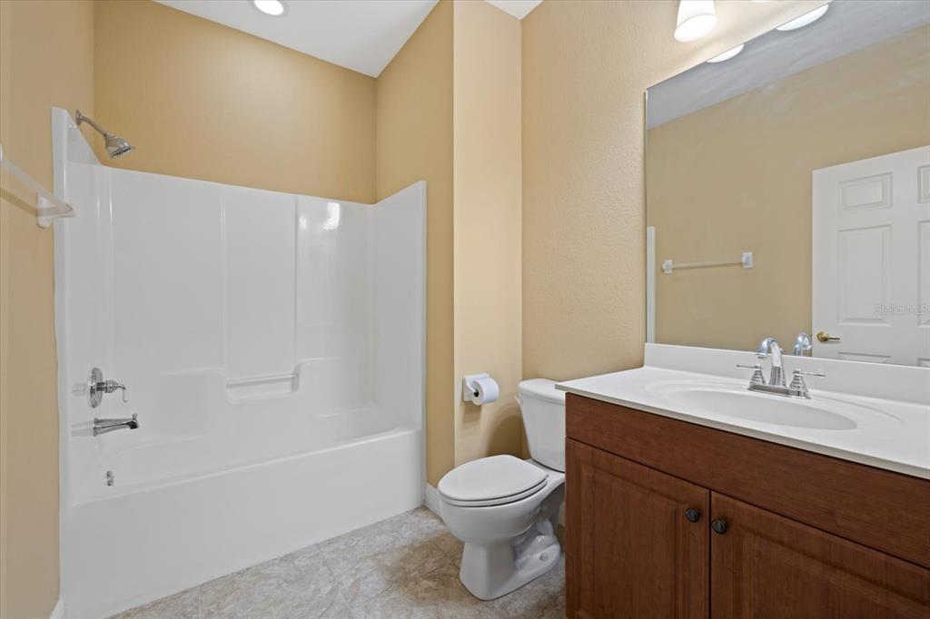 4331 Turnberry Circle North Port, FL 34288 - Photo 18 of 25 a bathroom with a sink a toilet and shower