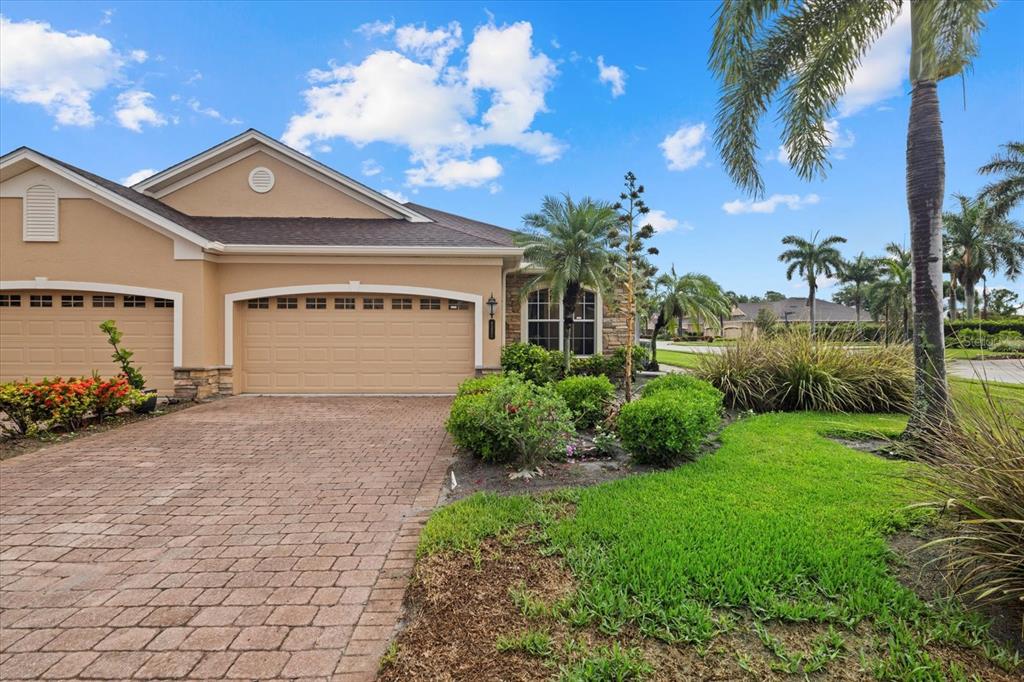 4331 Turnberry Circle North Port, FL 34288 - Photo 2 of 25 a front view of a house with garden
