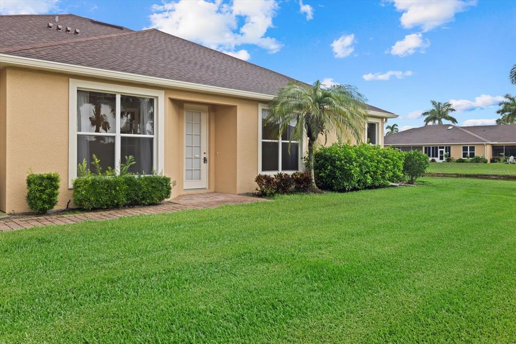 4331 Turnberry Circle North Port, FL 34288 - Photo 23 of 25 a front view of a house with a yard