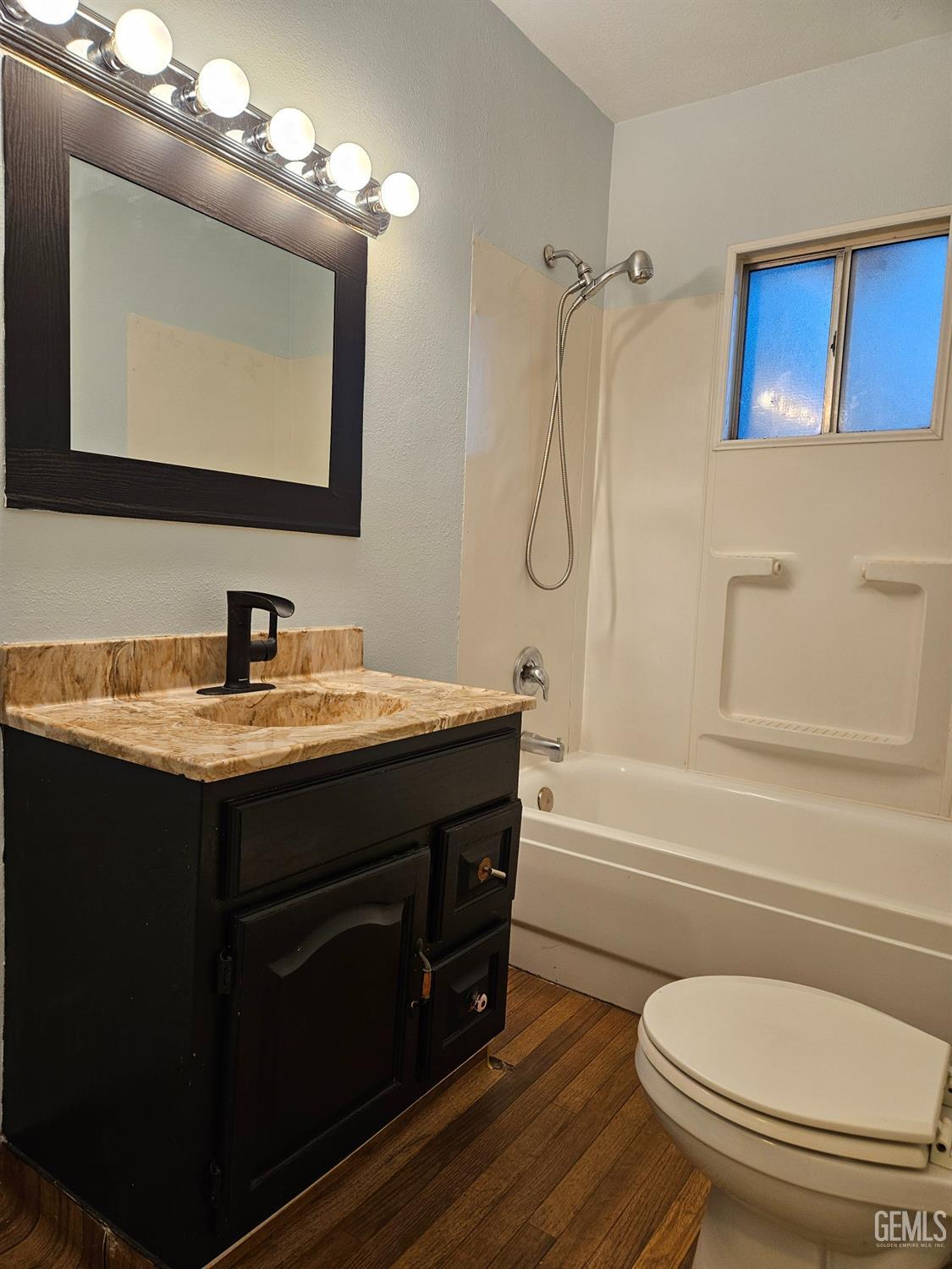 Undisclosed Address Wasco, CA 93280 - Photo 12 of 16 a bathroom with a toilet a sink and bathtub