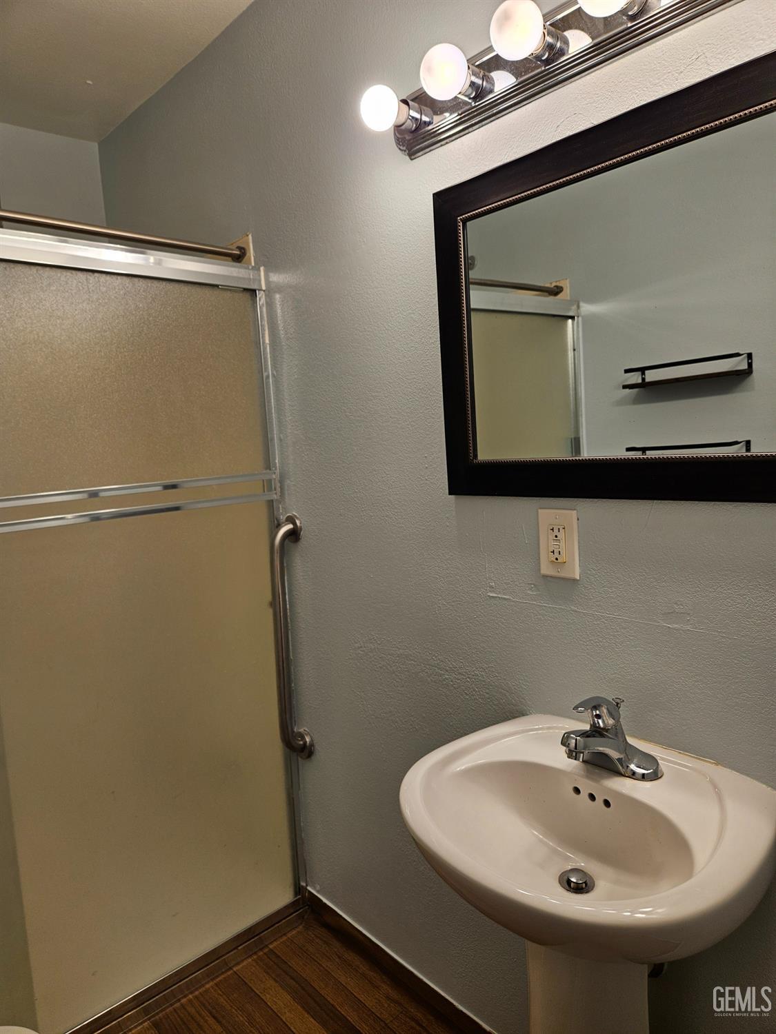 Undisclosed Address Wasco, CA 93280 - Photo 14 of 16 a bathroom with a sink and mirror