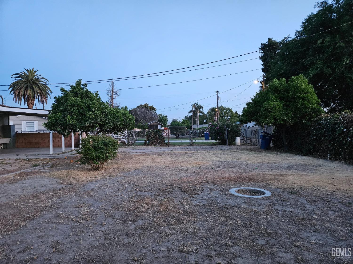 Undisclosed Address Wasco, CA 93280 - Photo 15 of 16 a view of a field with tress in front of it