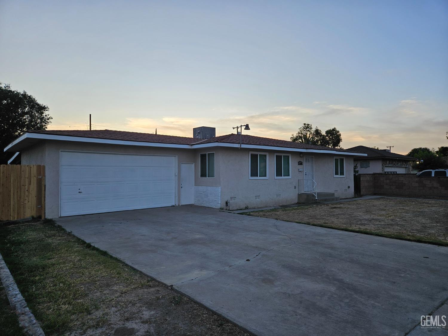 Undisclosed Address Wasco, CA 93280 - Photo 2 of 16 a view of a house with a backyard