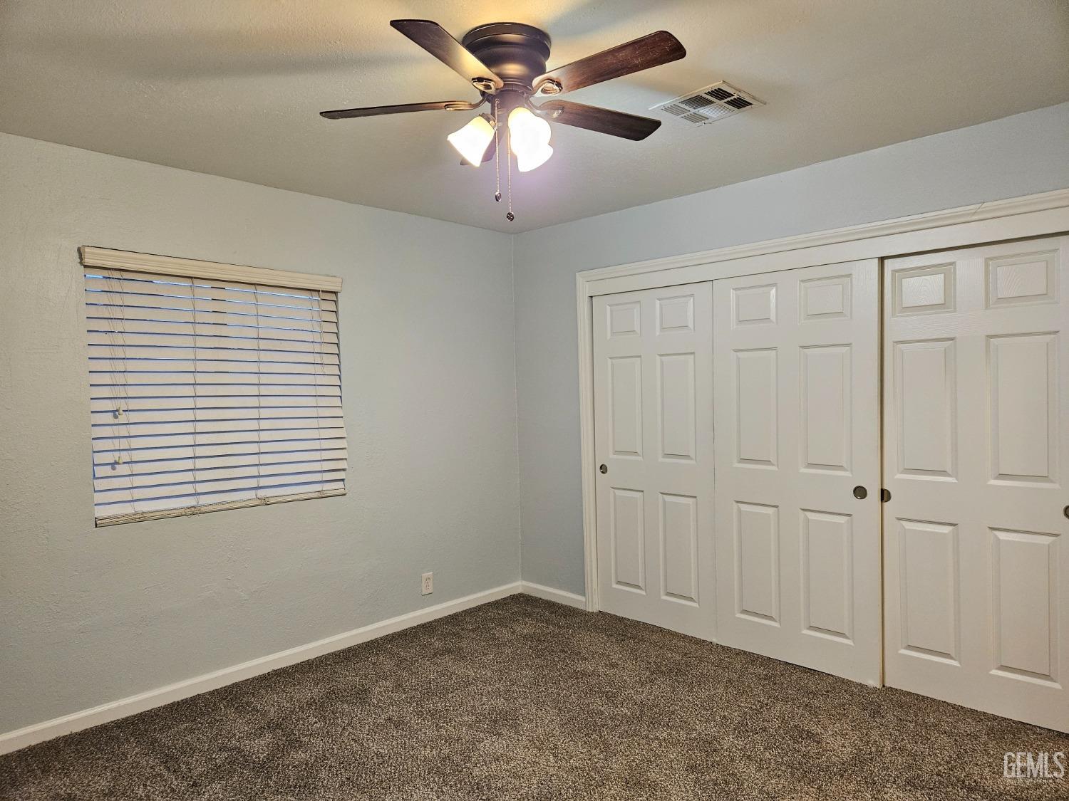 Undisclosed Address Wasco, CA 93280 - Photo 10 of 16 a view of an empty room with a window