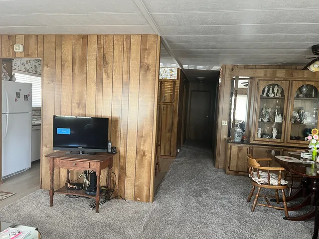 a bedroom with a bed and a mirror