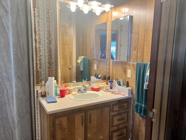 a bathroom with bathtub and window