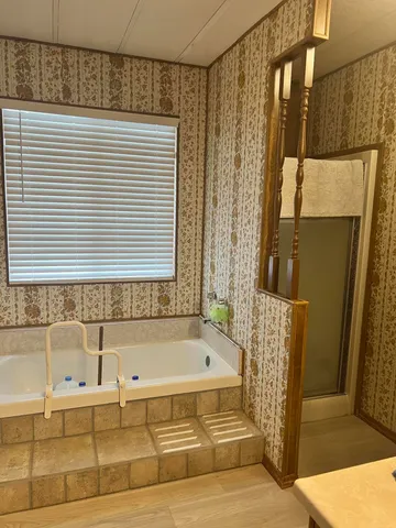 a bathroom with a toilet a sink and garden