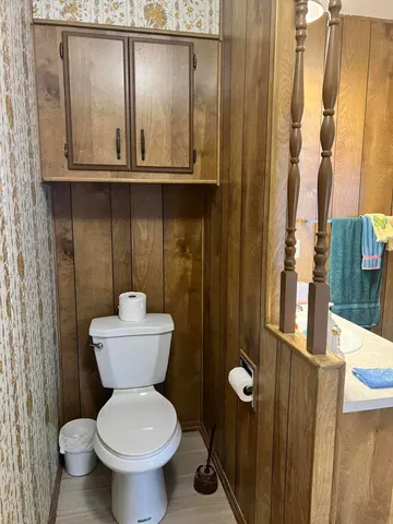 a bedroom with a bed and with windows