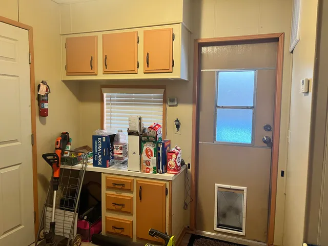 a view of a porch with furniture and garden