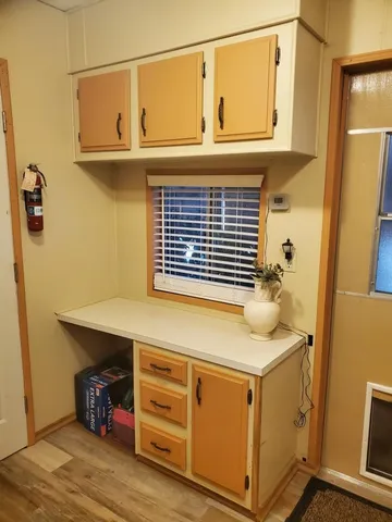 a view of a porch with furniture and garden