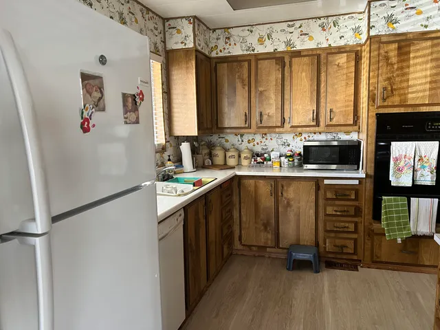 a kitchen with sink a cabinets and window