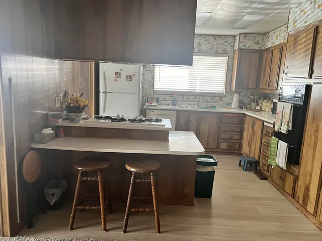 a living room with furniture a window and a flat screen tv