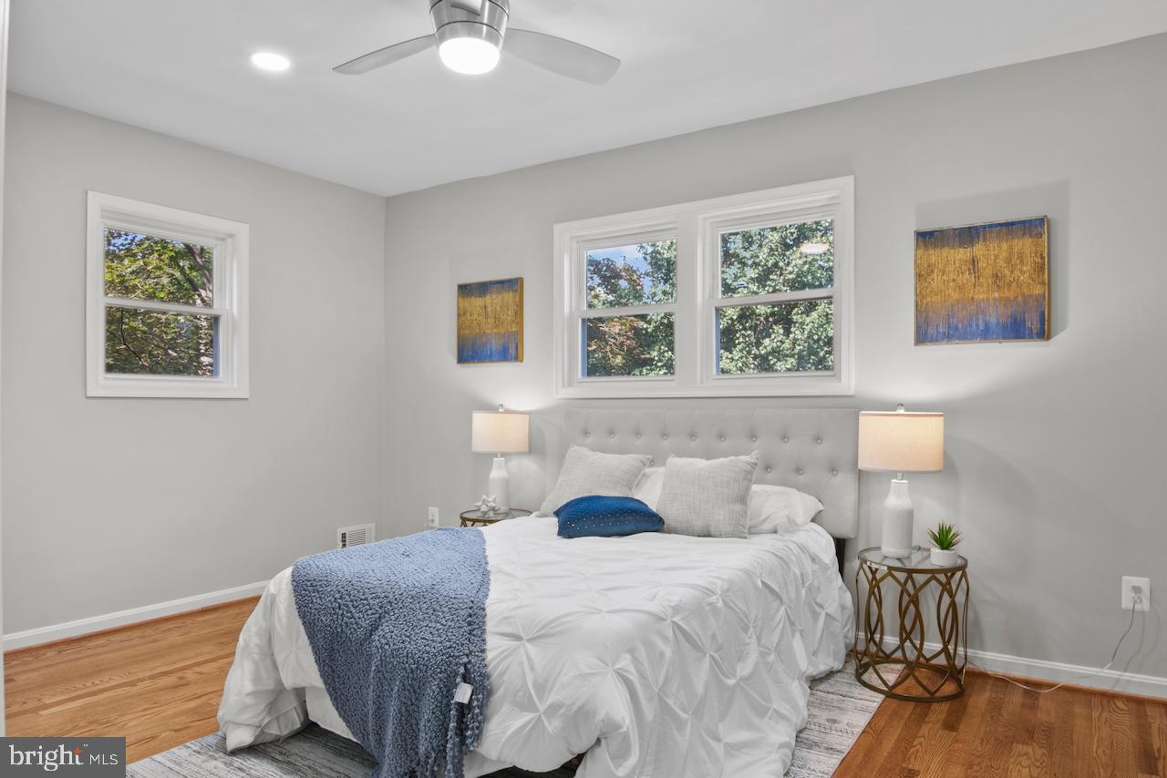 6502 Fort Hunt Road Alexandria, VA 22307 - Photo 17 of 44 a bedroom with a bed and wooden floor