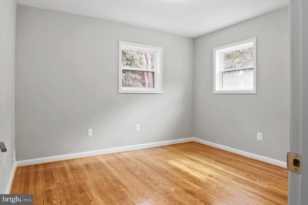 6502 Fort Hunt Road Alexandria, VA 22307 - Photo 24 of 44 a view of an empty room with wooden floor
