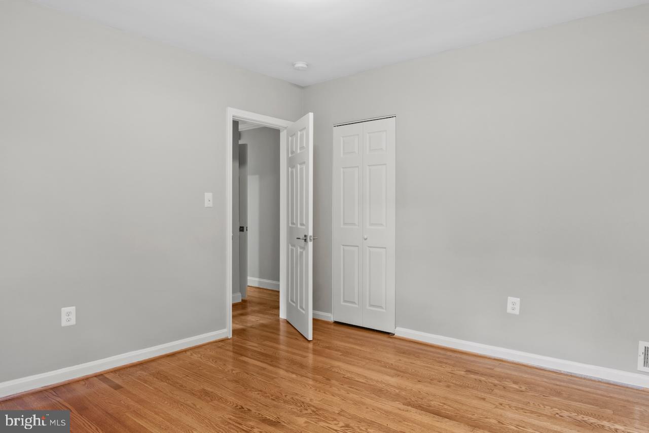 6502 Fort Hunt Road Alexandria, VA 22307 - Photo 25 of 44 a view of an empty room with wooden floor