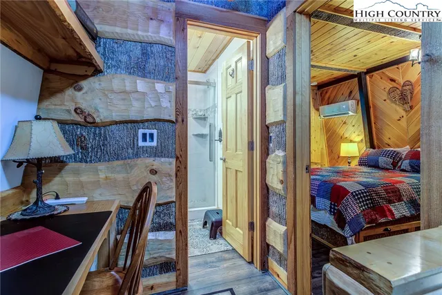 a view of a balcony with furniture and a potted plant