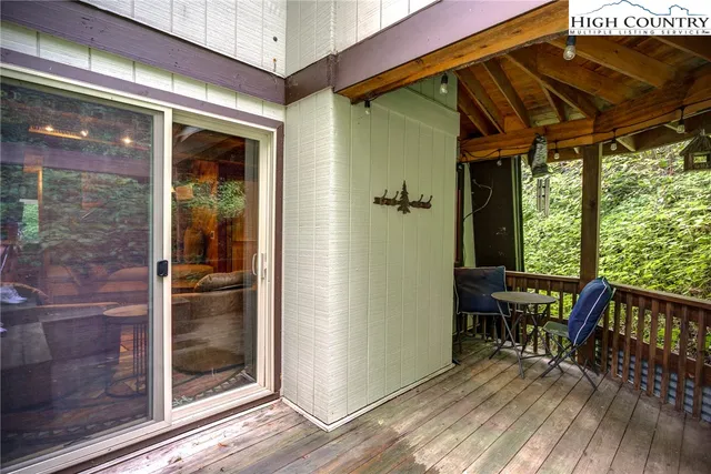 a view of a wooden deck with a bench