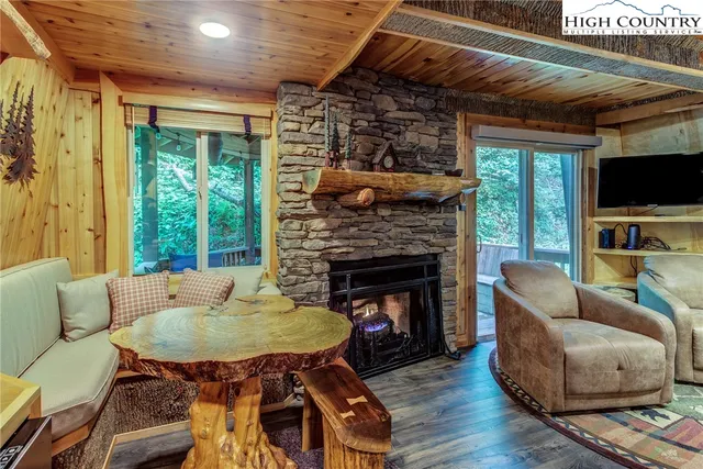 a dining room with furniture window and wooden floor