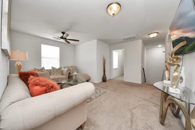a living room with furniture and a table