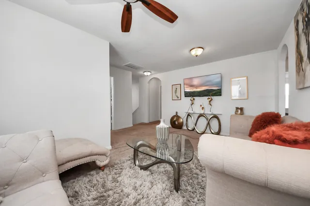 a living room with furniture and a couch
