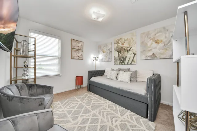 a living room with furniture and window