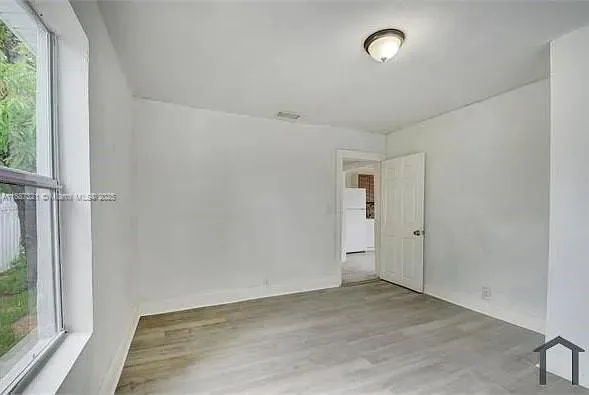 an empty room with windows